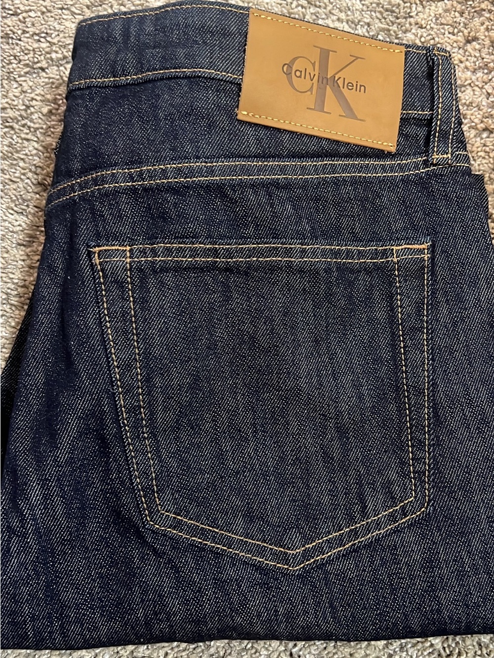 Calvin Klein Slim Straight Dark Indigo Jeans with Tan Patch